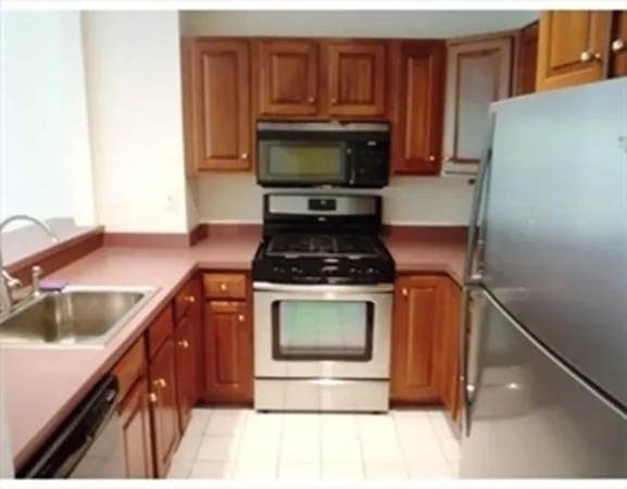 a kitchen with a stove and a microwave