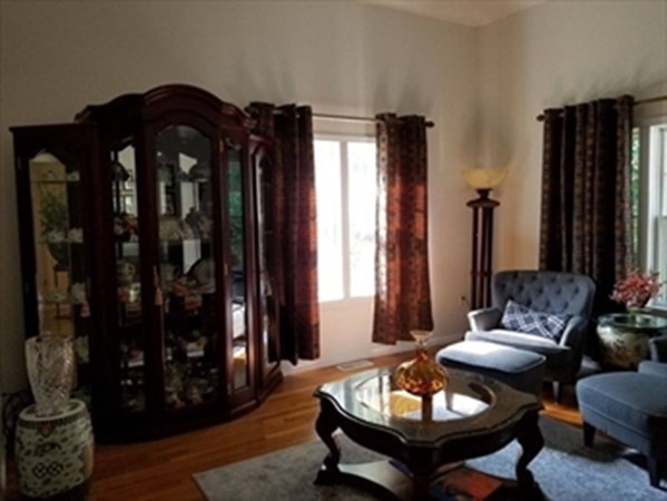 12 N Commons, Unit L Lincoln, MA 01773 - Photo 10 of 25 a living room with furniture and wooden floor