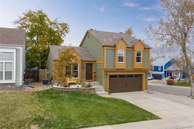 a front view of house with yard outdoor seating and barbeque oven