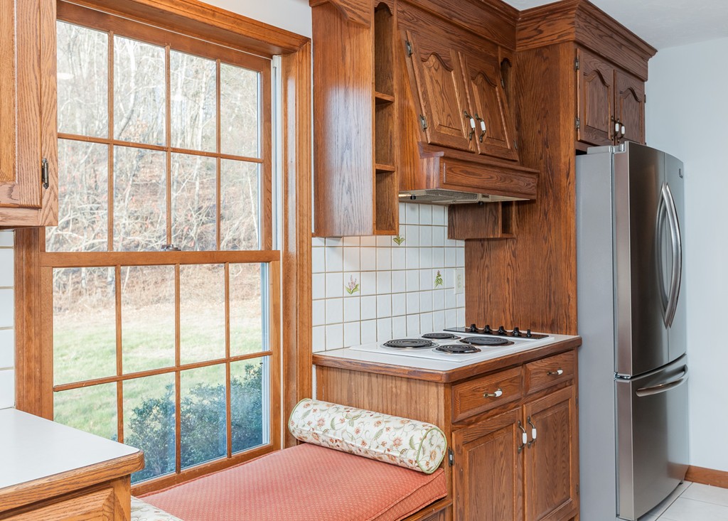 30 Main Road Montgomery, MA 01085 - Photo 16 of 30 a kitchen with stainless steel appliances granite countertop a stove and a refrigerator