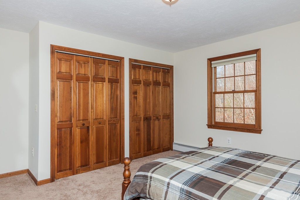 30 Main Road Montgomery, MA 01085 - Photo 26 of 30 a bedroom with a bed and a window
