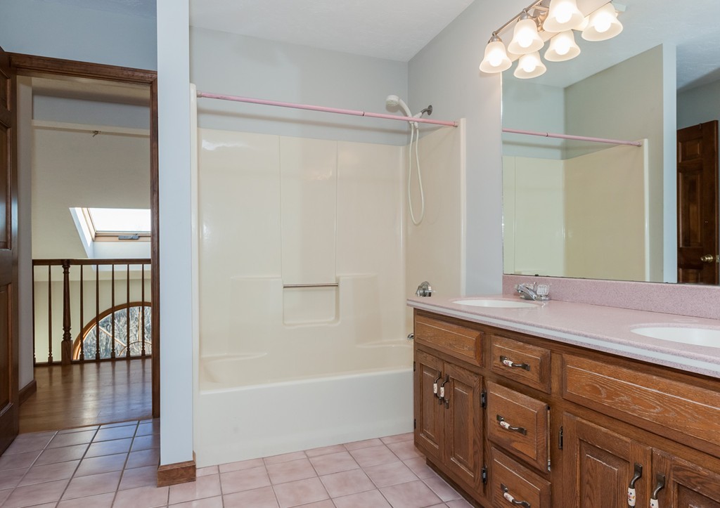 30 Main Road Montgomery, MA 01085 - Photo 28 of 30 a bathroom with a tub sink and mirror