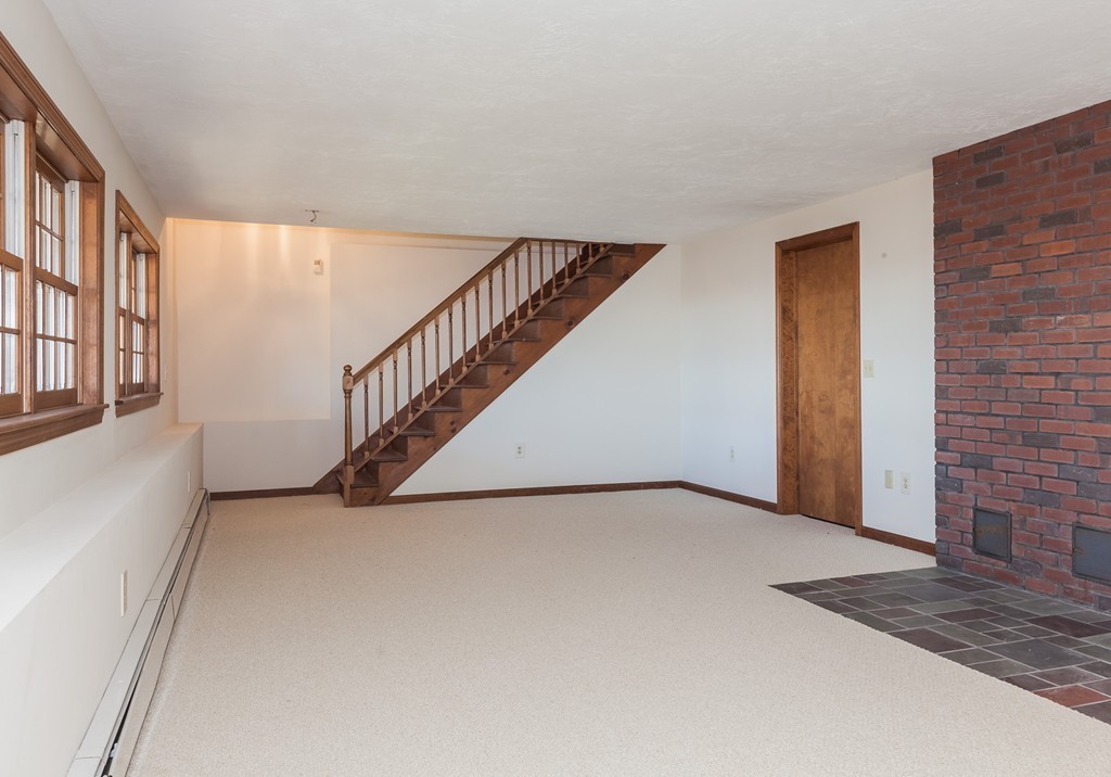 30 Main Road Montgomery, MA 01085 - Photo 30 of 30 a view of an empty room with wooden floor and stairs