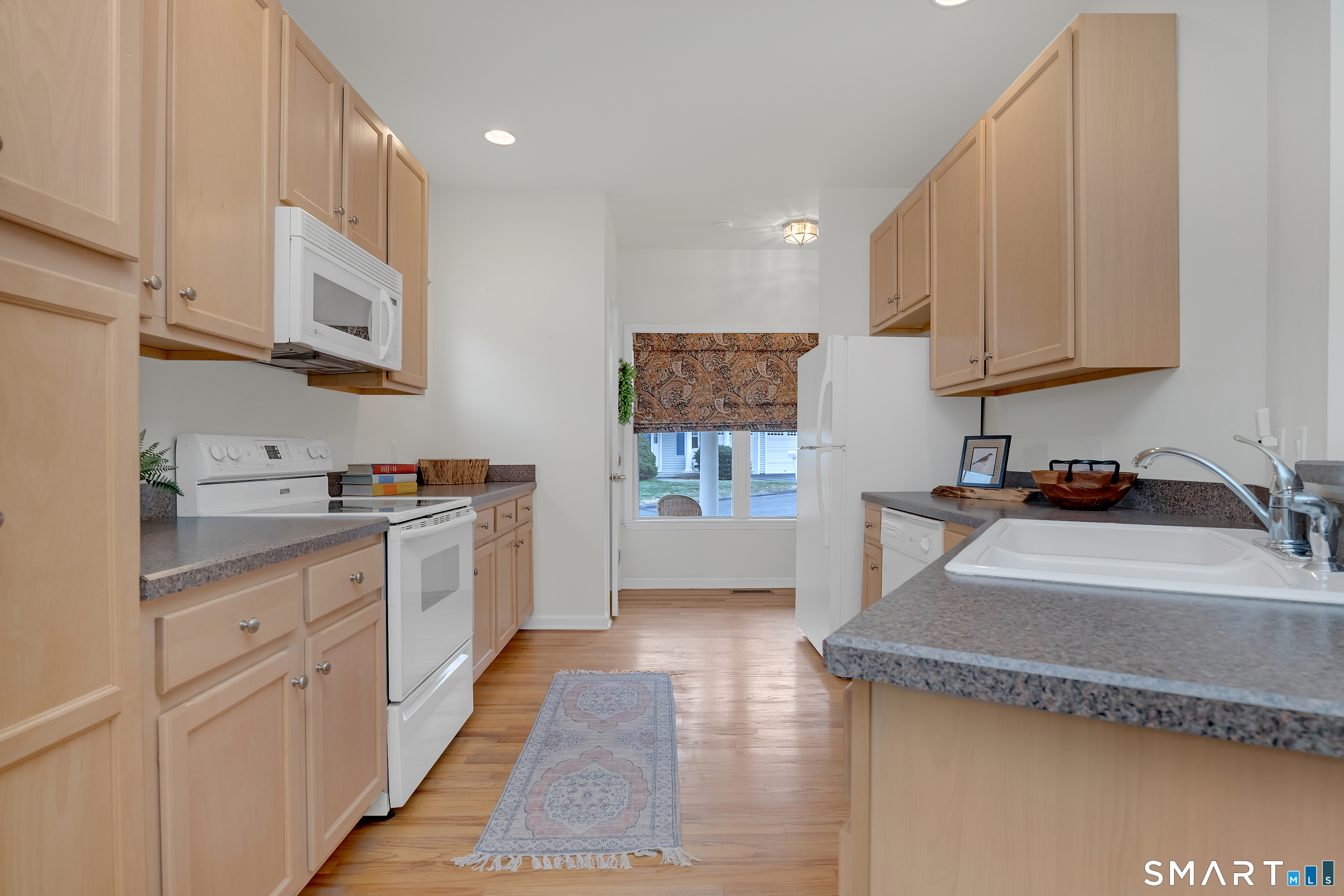 9 Pear Orchard Road, Unit 9 Portland, CT 06480 - Photo 15 of 38 a kitchen with stainless steel appliances granite countertop a sink and a stove