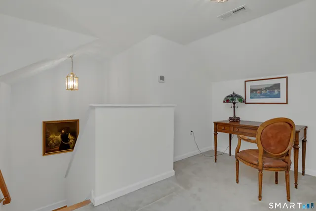 a view of a workspace with furniture