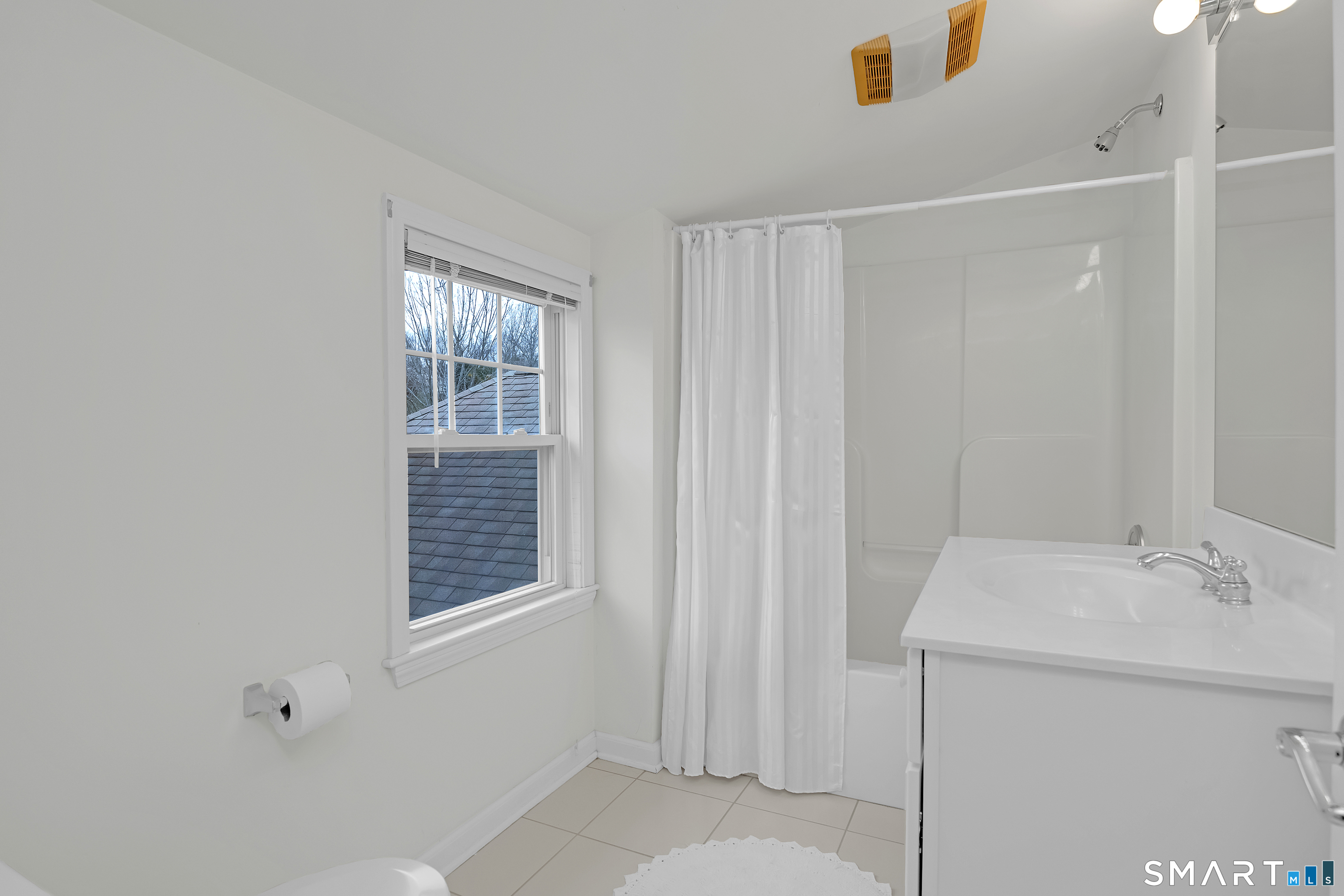 9 Pear Orchard Road, Unit 9 Portland, CT 06480 - Photo 26 of 38 a bathroom with a sink vanity and a window