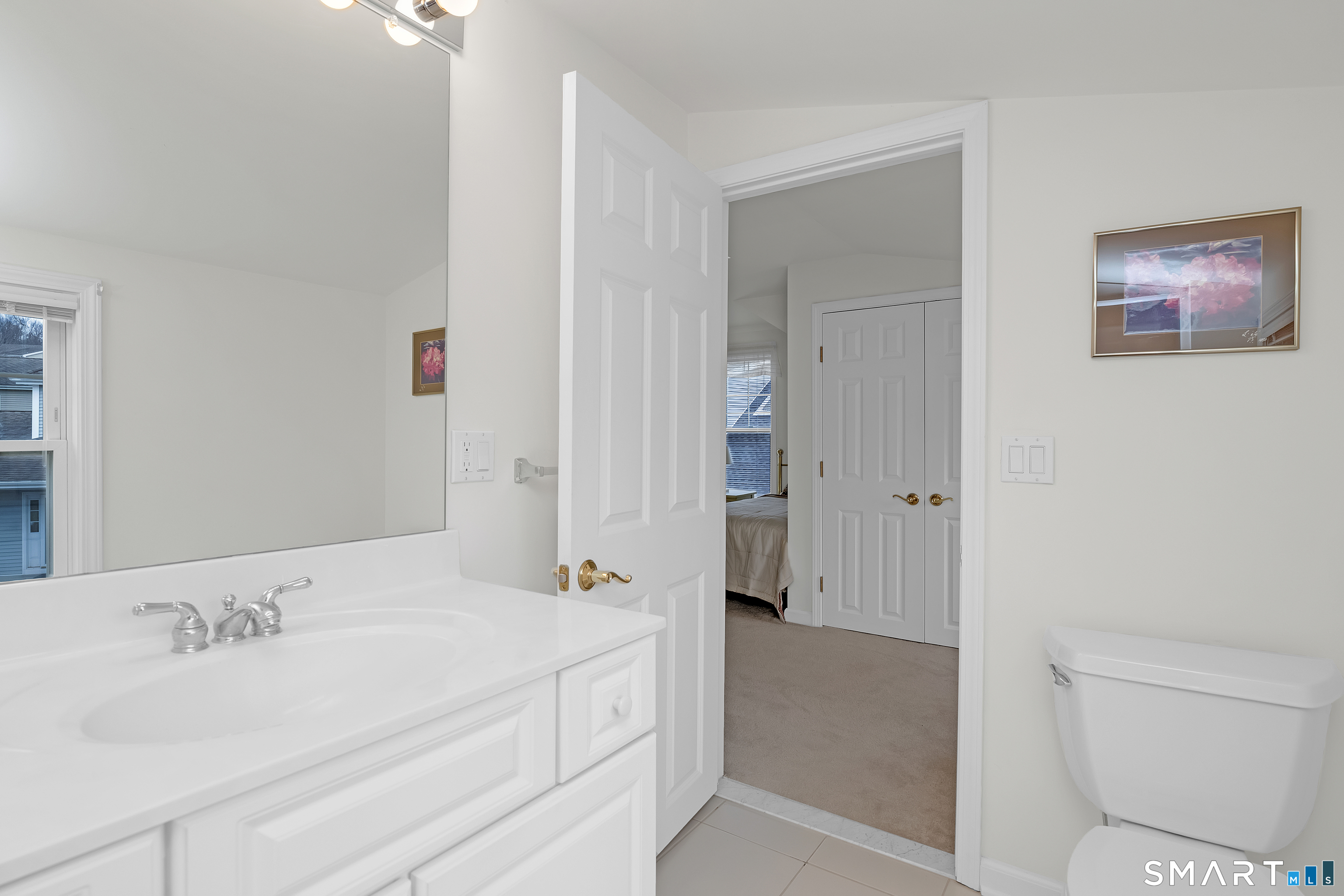 9 Pear Orchard Road, Unit 9 Portland, CT 06480 - Photo 27 of 38 a bathroom with a granite countertop sink a toilet and shower