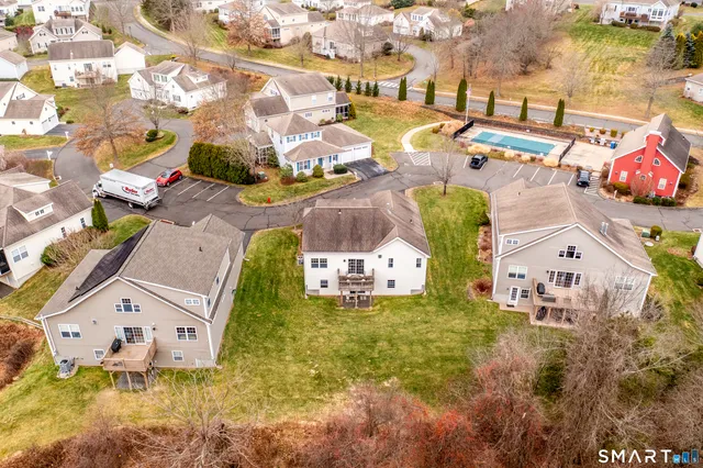 an aerial view of residential houses with outdoor space