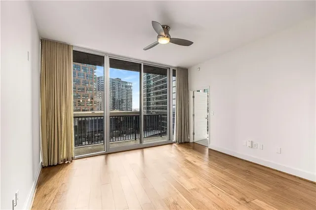 a bathroom with a granite countertop sink toilet and mirror