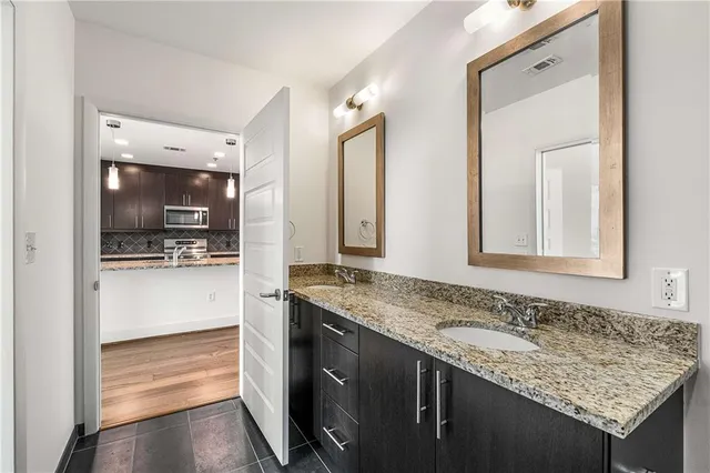 a view of a livingroom with a ceiling fan and window