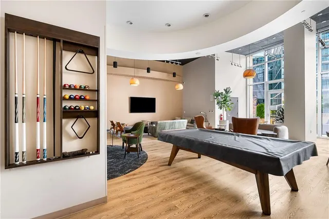 a dining room with furniture and wooden floor