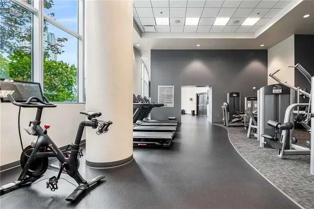 a swimming pool with outdoor seating and city view