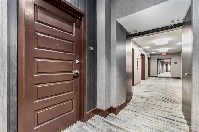 a view of a hallway with closet