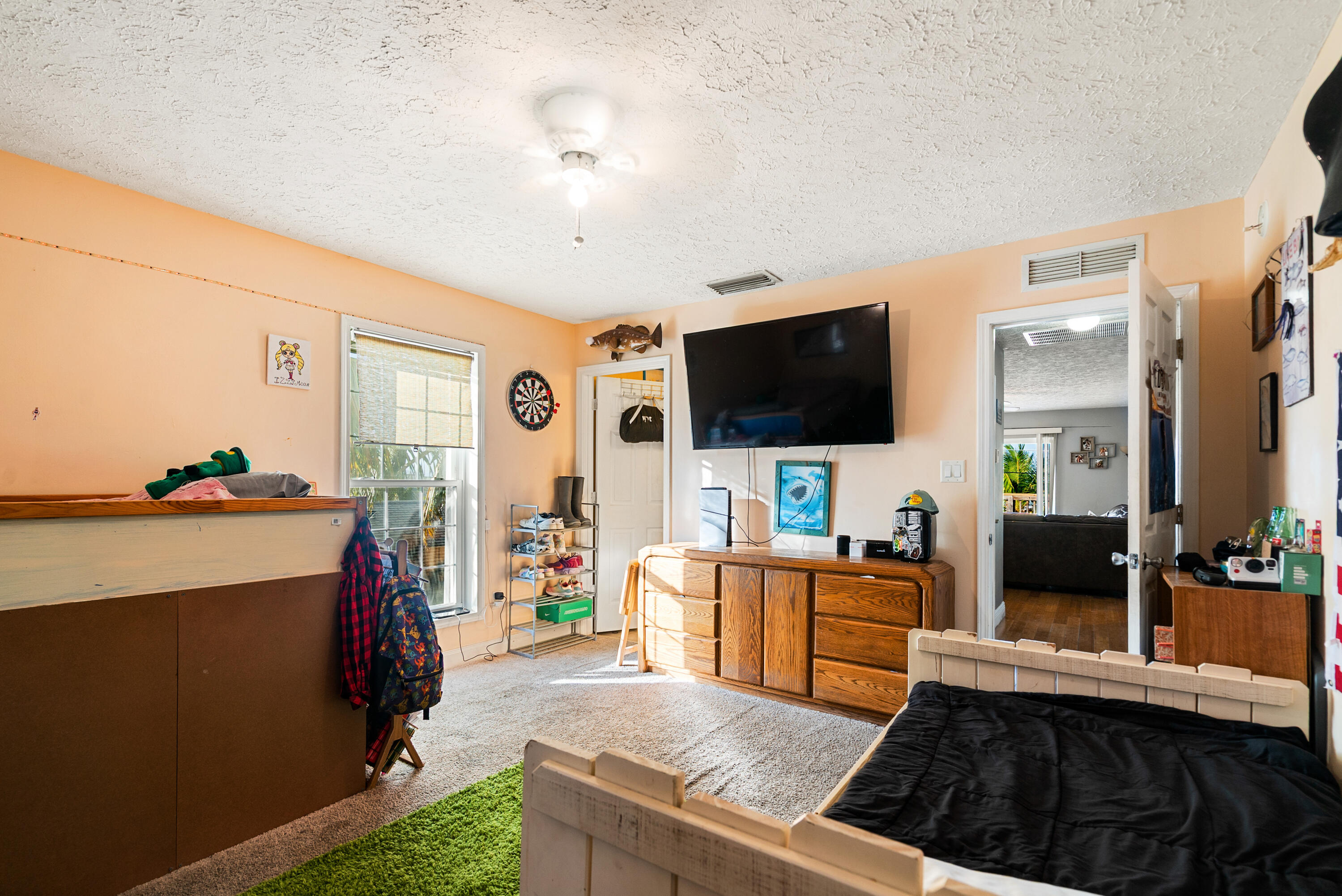 192 2nd Court Key Largo, FL 33037 - Photo 16 of 44 a living room with furniture and a flat screen tv