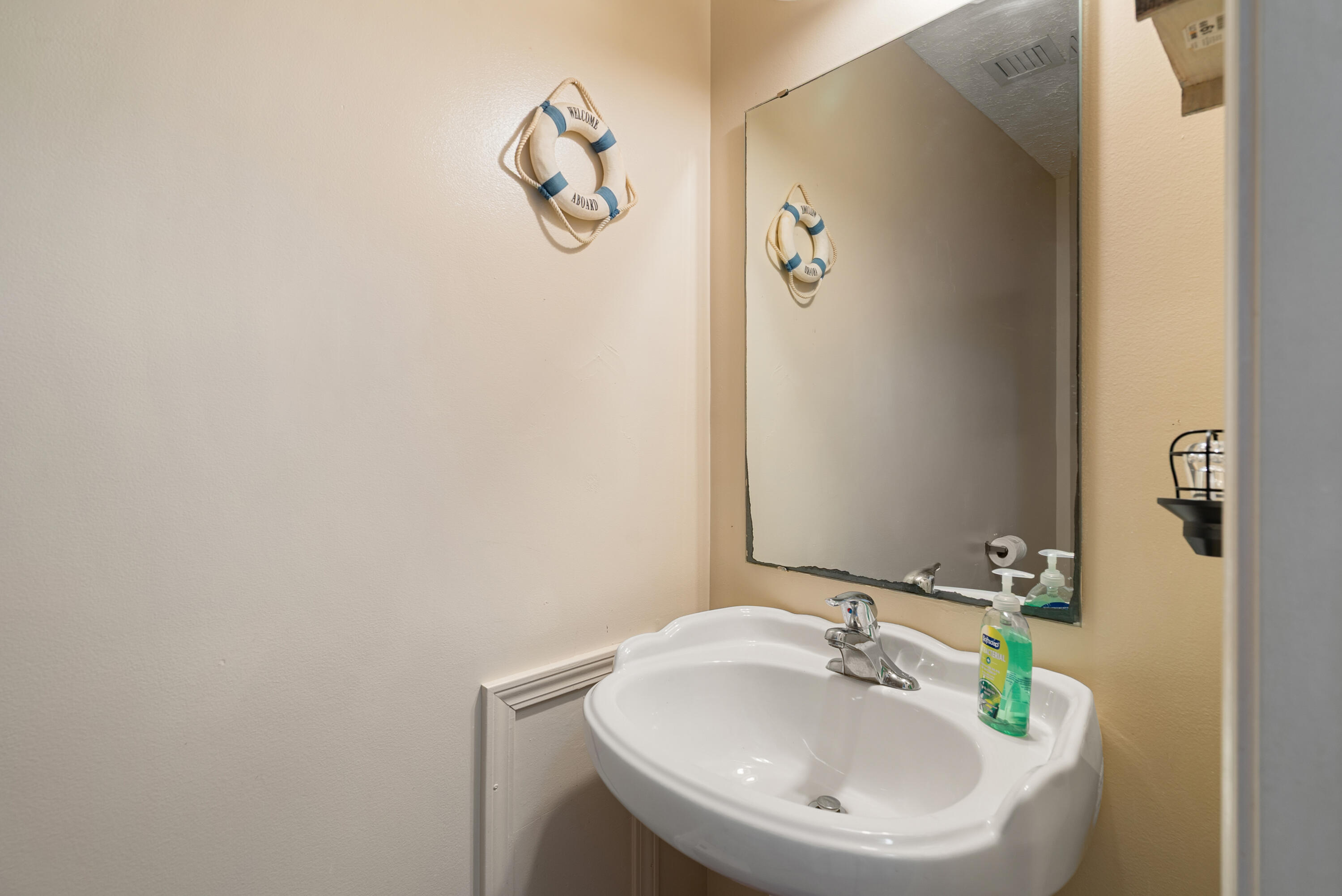 192 2nd Court Key Largo, FL 33037 - Photo 18 of 44 a bathroom with a sink and a mirror