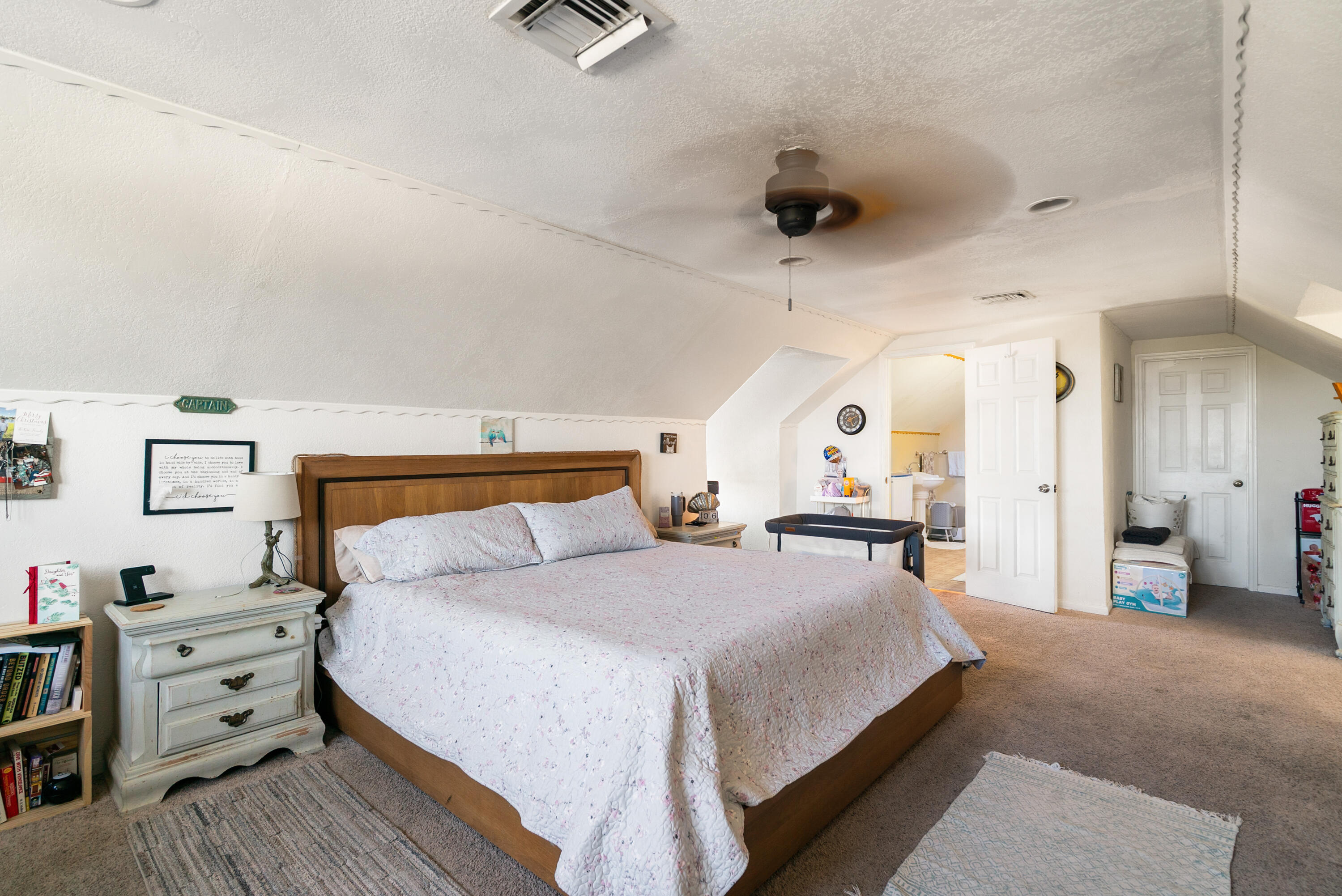 192 2nd Court Key Largo, FL 33037 - Photo 20 of 44 a large bedroom with a bed and wooden floor