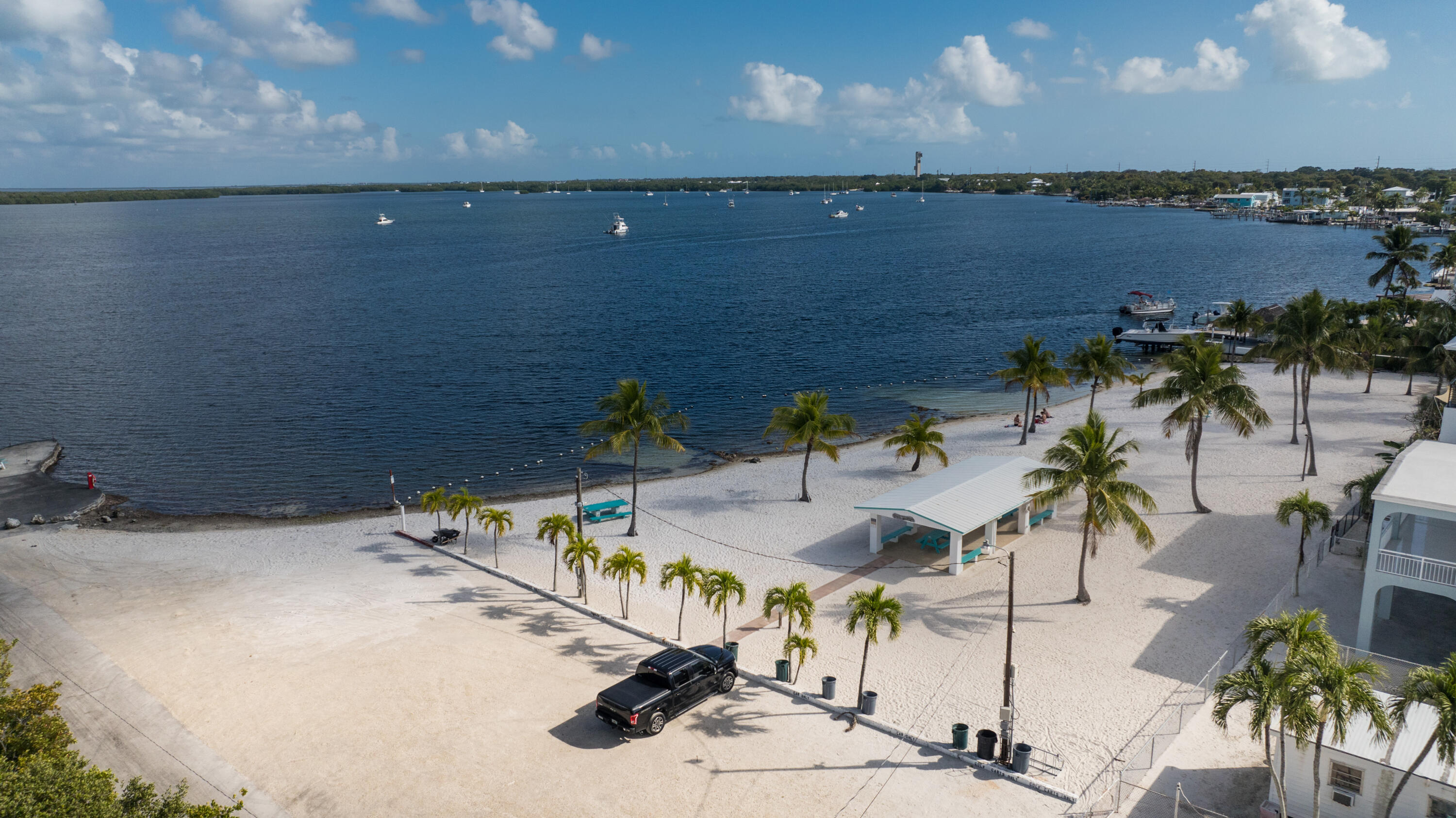 192 2nd Court Key Largo, FL 33037 - Photo 3 of 44 a view of a lake with a table and chairs