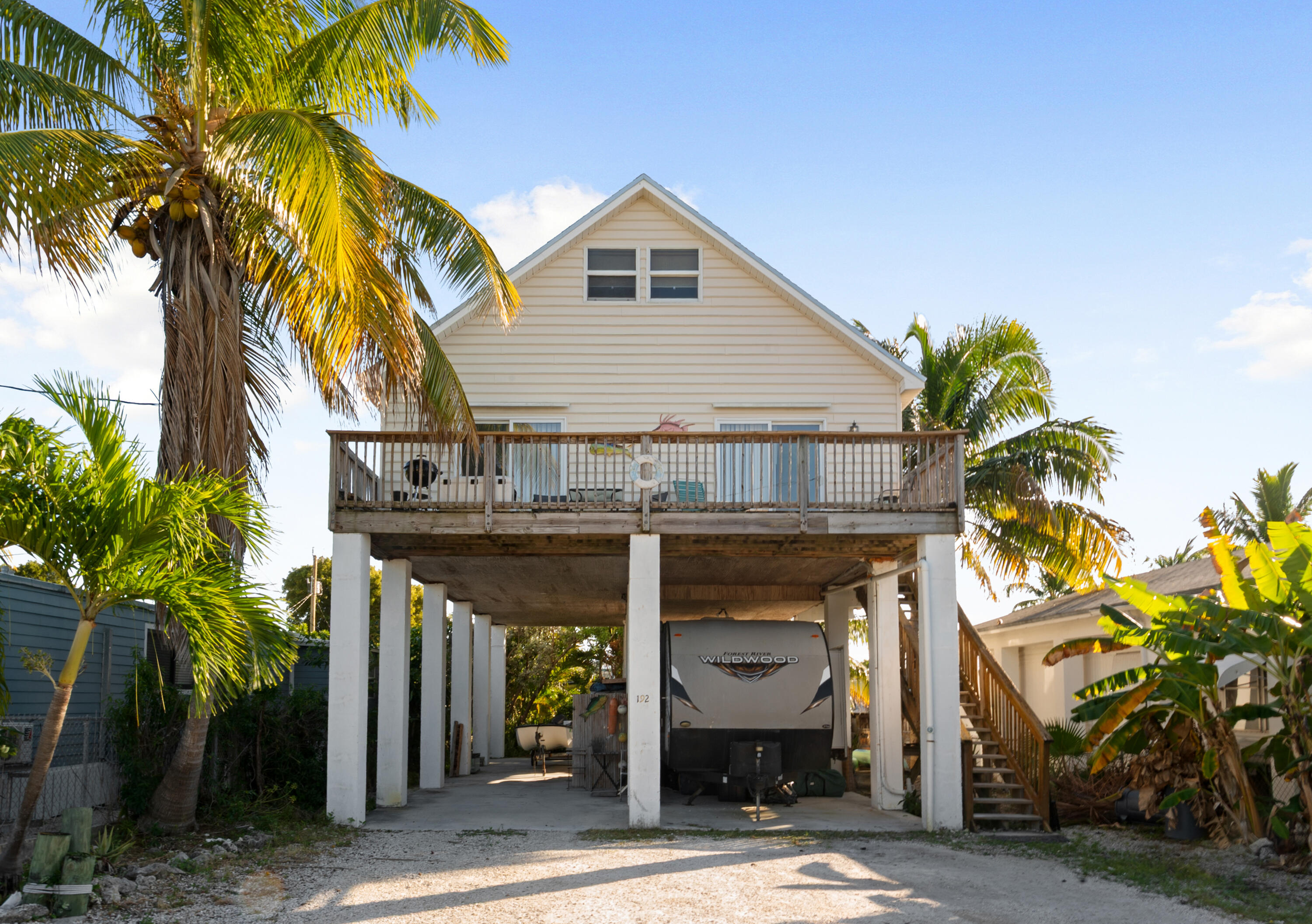 192 2nd Court Key Largo, FL 33037 - Photo 44 of 44 a view of a house with a tree and a yard