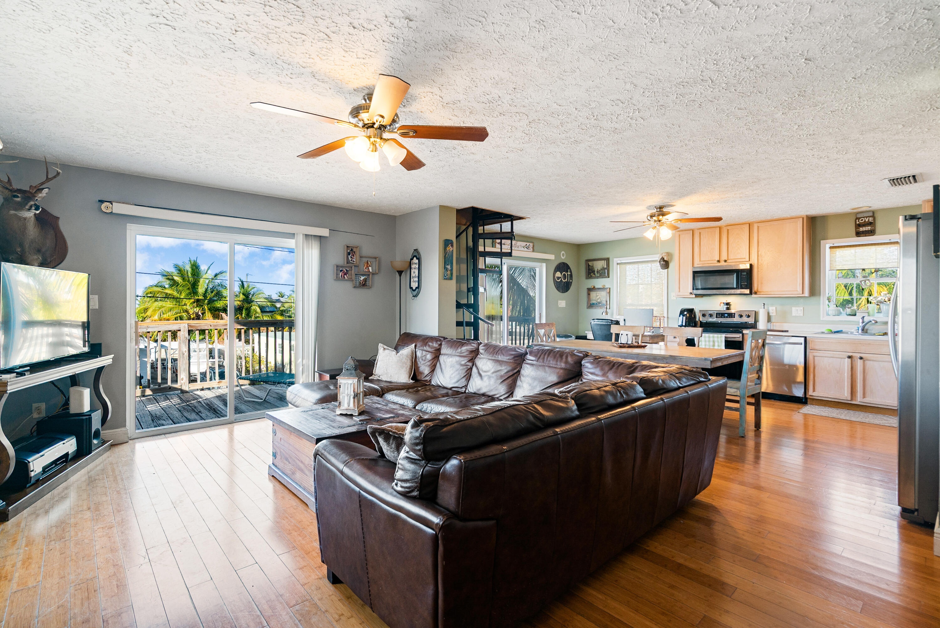 192 2nd Court Key Largo, FL 33037 - Photo 5 of 44 a living room with furniture and a flat screen tv