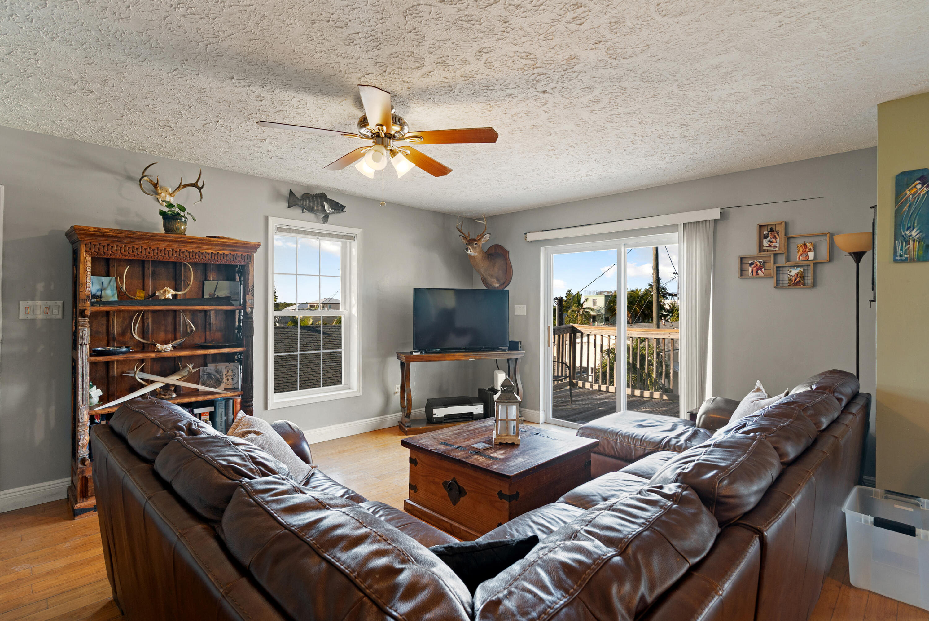 192 2nd Court Key Largo, FL 33037 - Photo 6 of 44 a living room with furniture fireplace and a flat screen tv