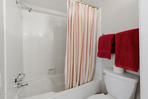 a bathroom with a bathtub and shower