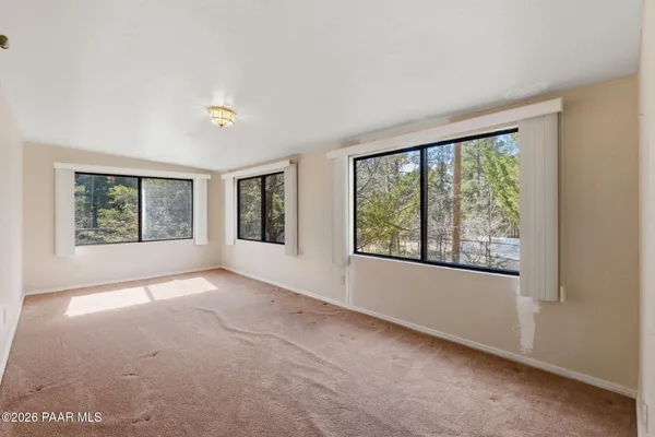 a view of an empty room with windows