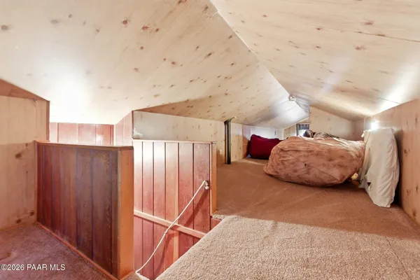 a bedroom with a bed and a cabinets