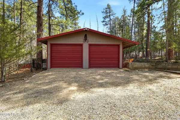 a view of a house with a yard and garage