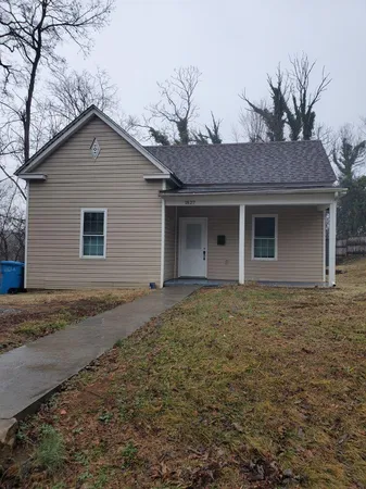 a house with trees in the background