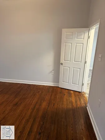 a view of a livingroom with wooden floor