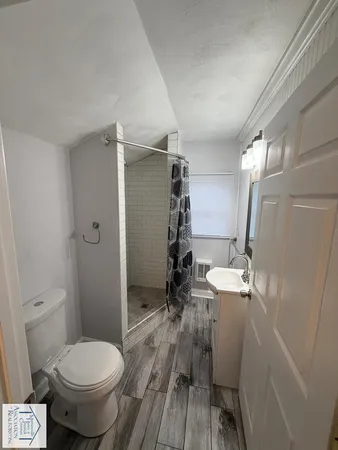 a kitchen with a sink a stove and refrigerator