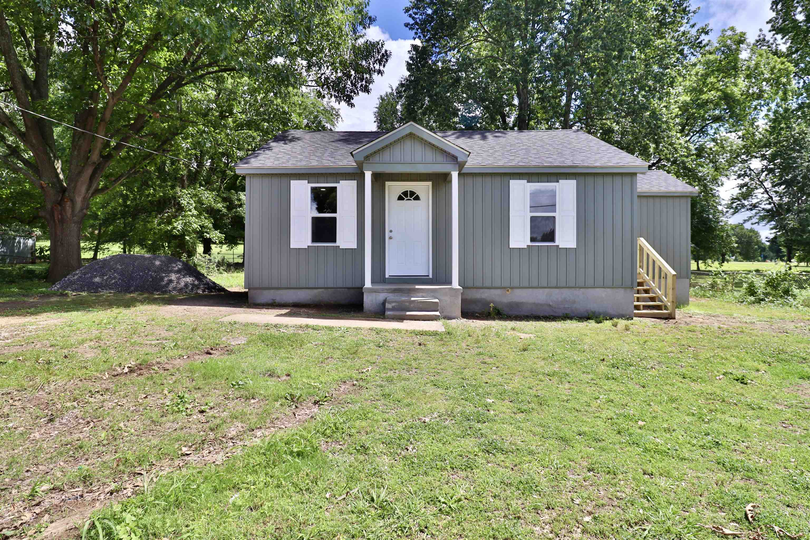 a house with yard in front of it