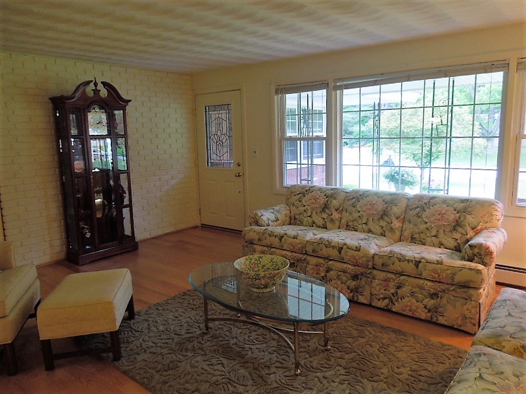 8 Howard Road Chelmsford, MA 01824 - Photo 15 of 30 a living room with furniture and a window