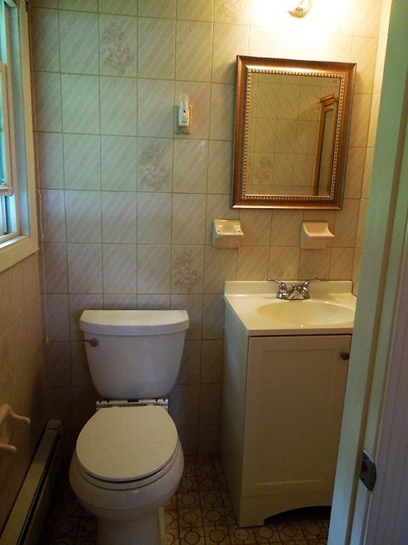 8 Howard Road Chelmsford, MA 01824 - Photo 22 of 30 a bathroom with a toilet sink and mirror