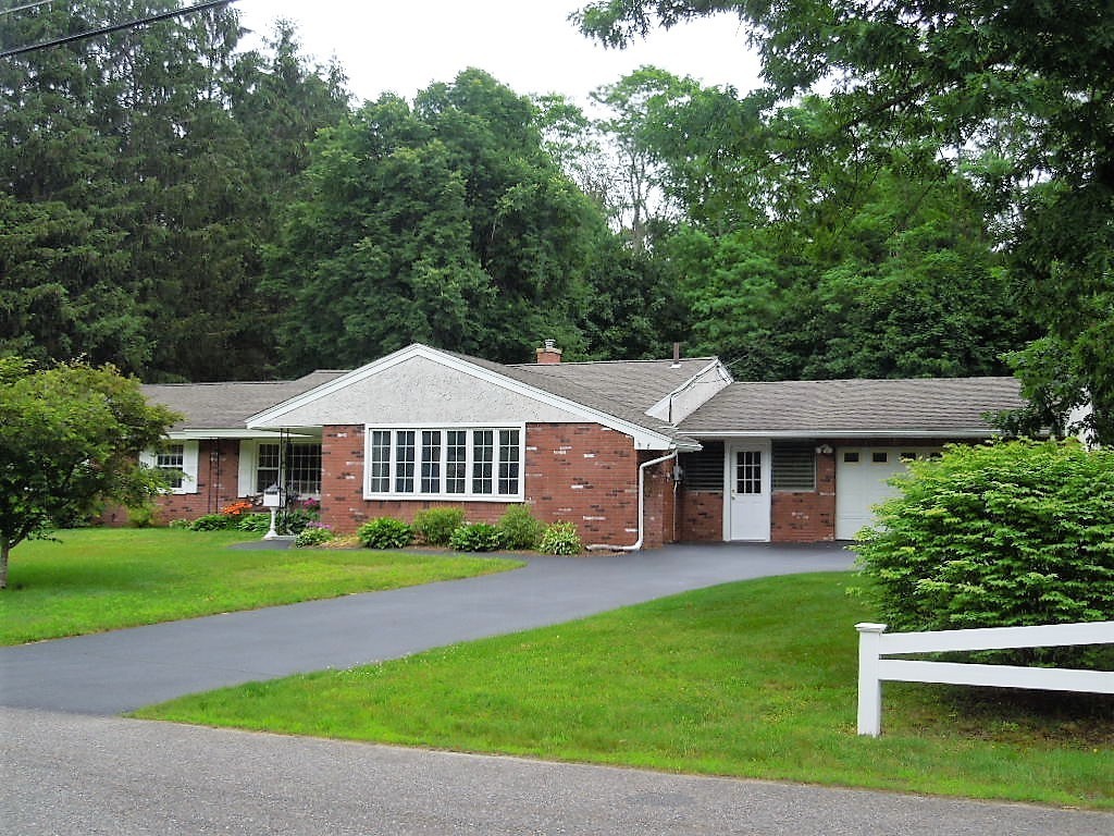 8 Howard Road Chelmsford, MA 01824 - Photo 27 of 30 a front view of a house with a garden