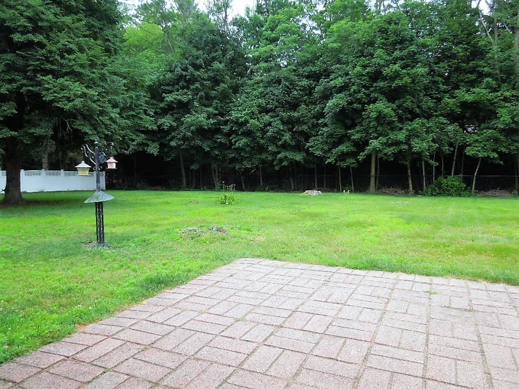 8 Howard Road Chelmsford, MA 01824 - Photo 30 of 30 a view of a backyard with a entertaining space
