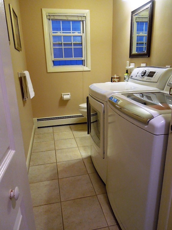 8 Howard Road Chelmsford, MA 01824 - Photo 8 of 30 a room with a washing machine