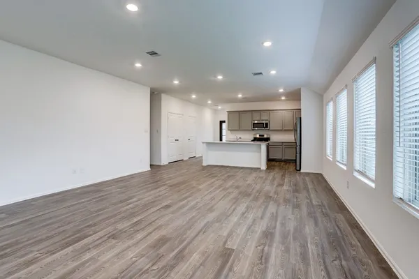 a view of kitchen with wooden floor
