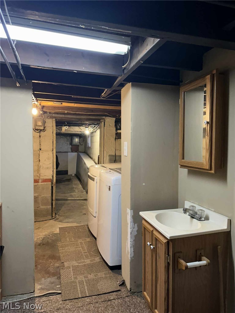 595 Jersey Ridge Road Zanesville, OH 43701 - Photo 15 of 20 Unfinished basement with separate washer and dryer and a sink