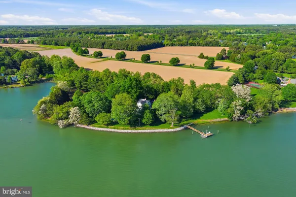 a view of a lake with a yard