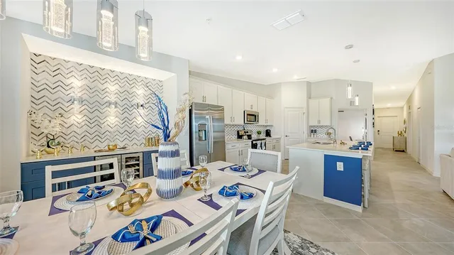 a bedroom with a bed a chandelier and a closet