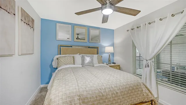 a view of a patio with a table and chairs and potted plants