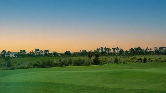 a view of yard with swimming pool and green space