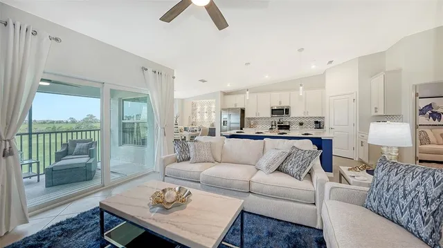 a kitchen that has a table and chairs in it