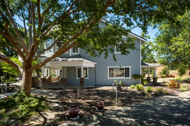 a house with trees in front of it