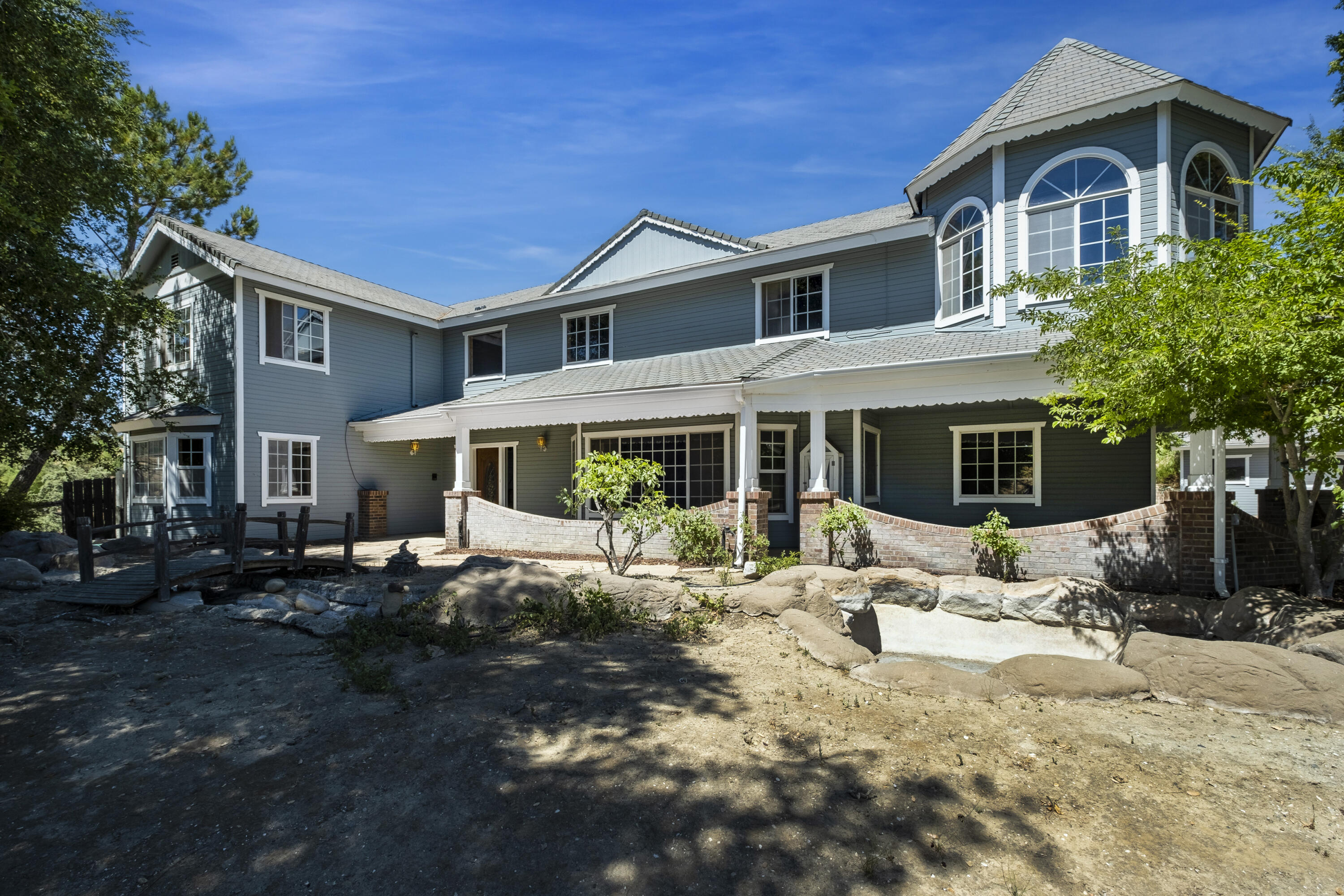 3160 Long Canyon Road Santa Ynez, CA 93460 - Photo 5 of 17 a front view of a house with a yard outdoor seating and covered with green space