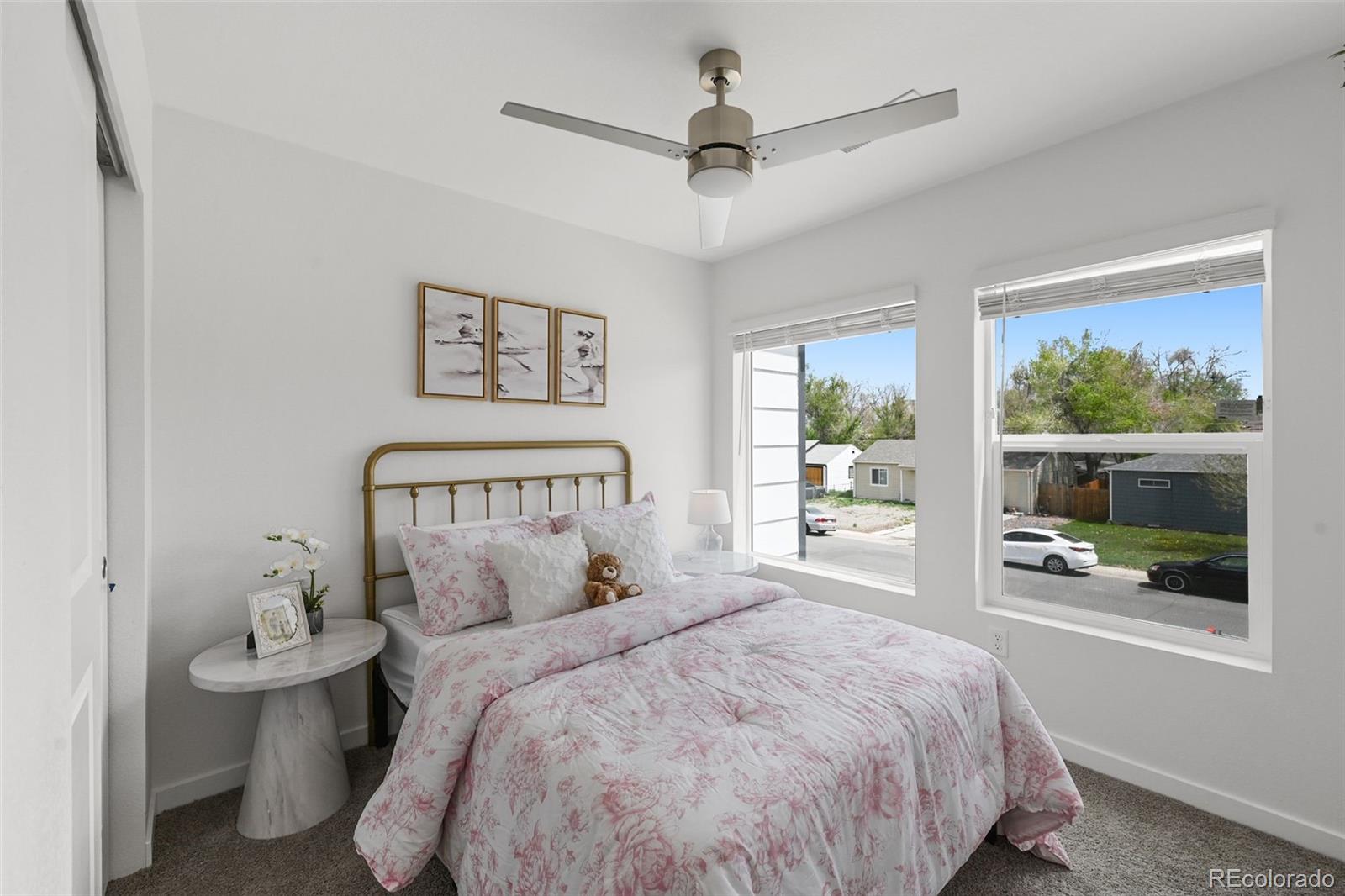 1304 Akron Street Aurora, CO 80010 - Photo 14 of 28 a bed room with a bed and a window