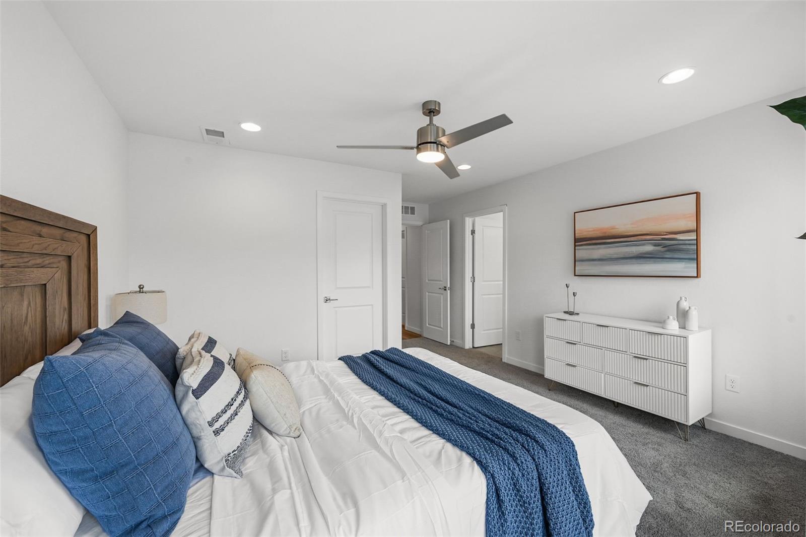 1304 Akron Street Aurora, CO 80010 - Photo 22 of 28 a bedroom with a bed and furniture