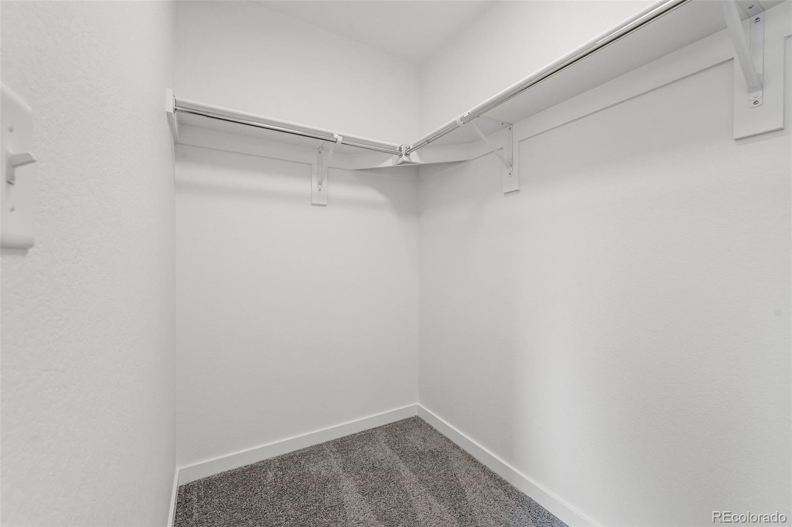 1304 Akron Street Aurora, CO 80010 - Photo 23 of 28 a view of an empty walk in closet
