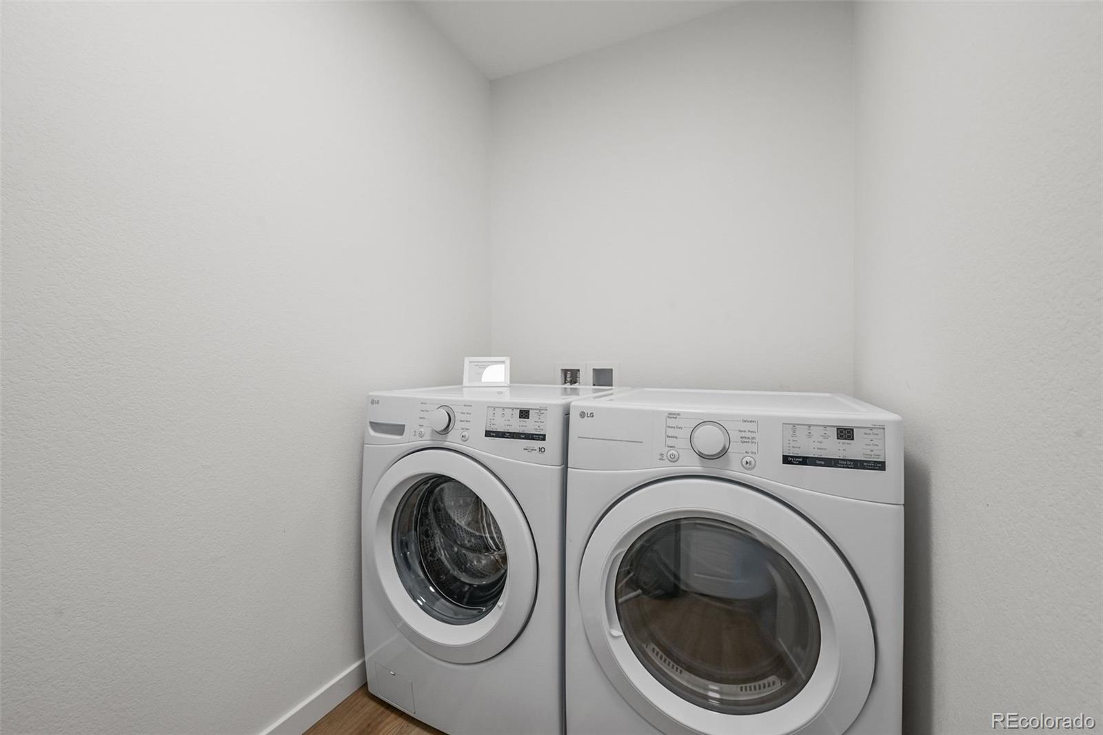 1304 Akron Street Aurora, CO 80010 - Photo 25 of 28 a utility room with dryer and washer